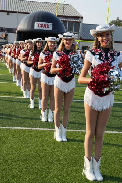 Cheerleaders standing in a line.